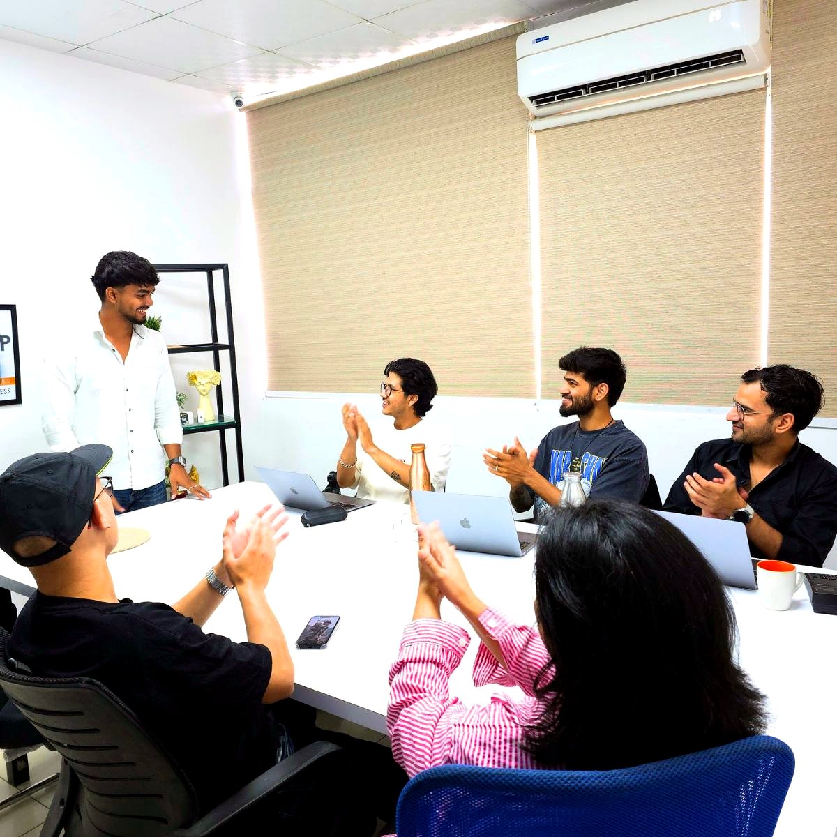 Team applauding in a meeting